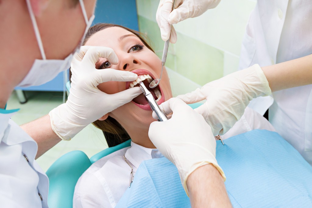 woman undergoing tooth extraction