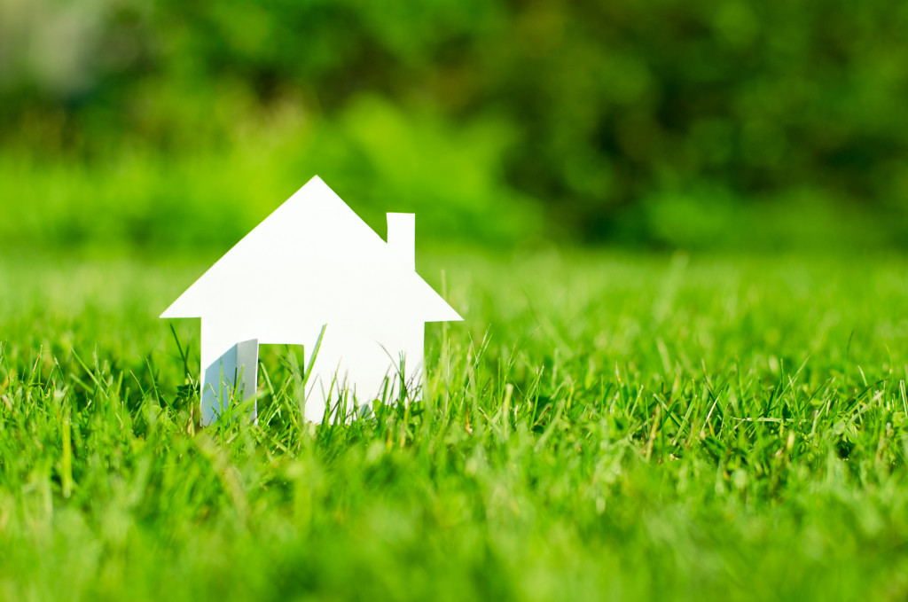 safeguarding investment in real estate with grass in field
